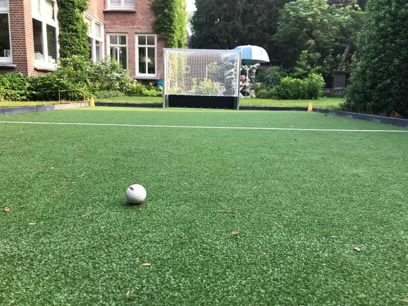 Speelrand hockeyveld - Kunstgrashuis